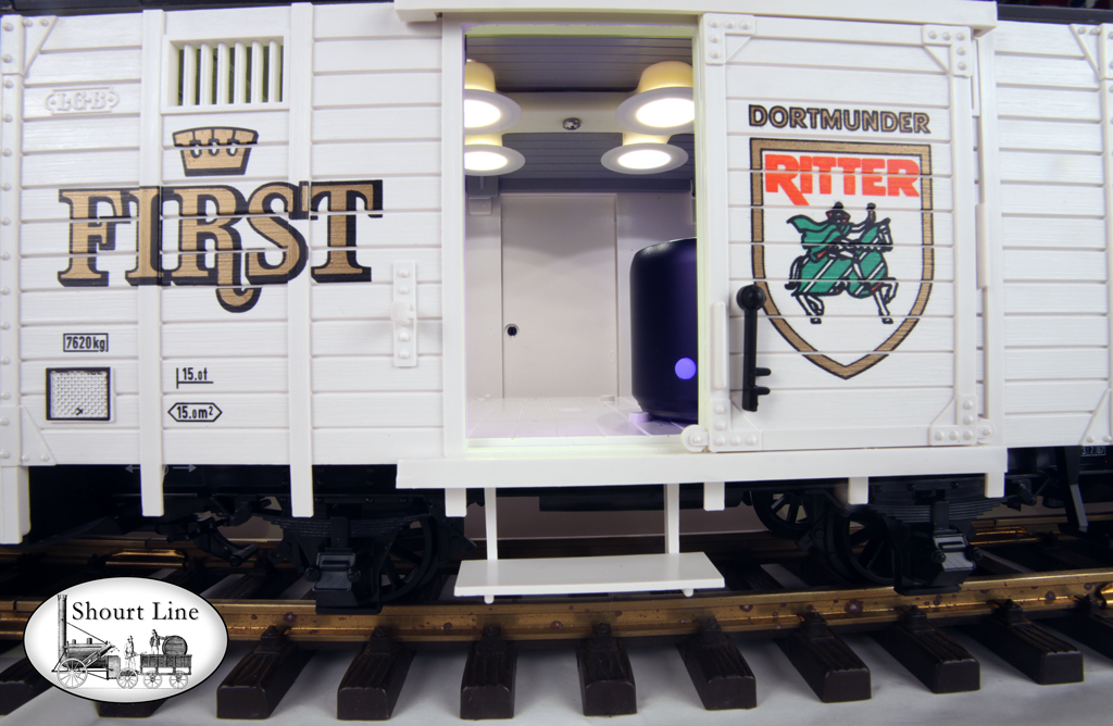 LGB 020087 Dortmund Beer Train w LGB 2020 Steam Loco, Tank, Freight, Passenger Cars, 14 Lights, Sound - Box car with side door open to show the Bluetooth wireless speaker.