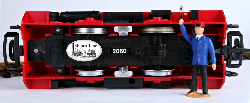 LGB 20412PV Philips GMBH Videospiele Diesel Loco Freight Tralin Starter Set LGB 2060PV Schoema CFL-150 diesel locomotive bottom view showing the 6 power pickups, 2 drice wheels and traction tire for extra pulling ower.